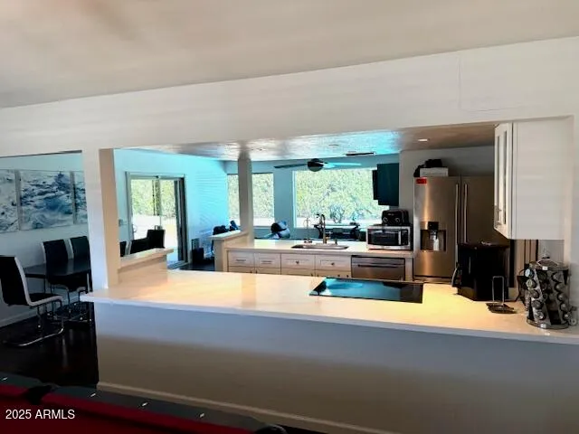 a view of living room with furniture and a flat screen tv