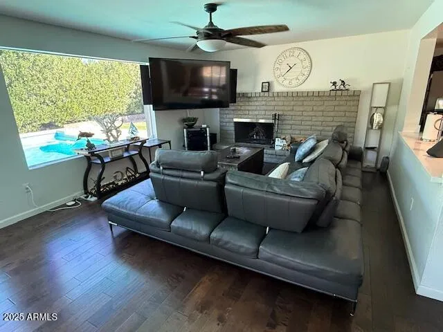 a living room with furniture fireplace and a flat screen tv