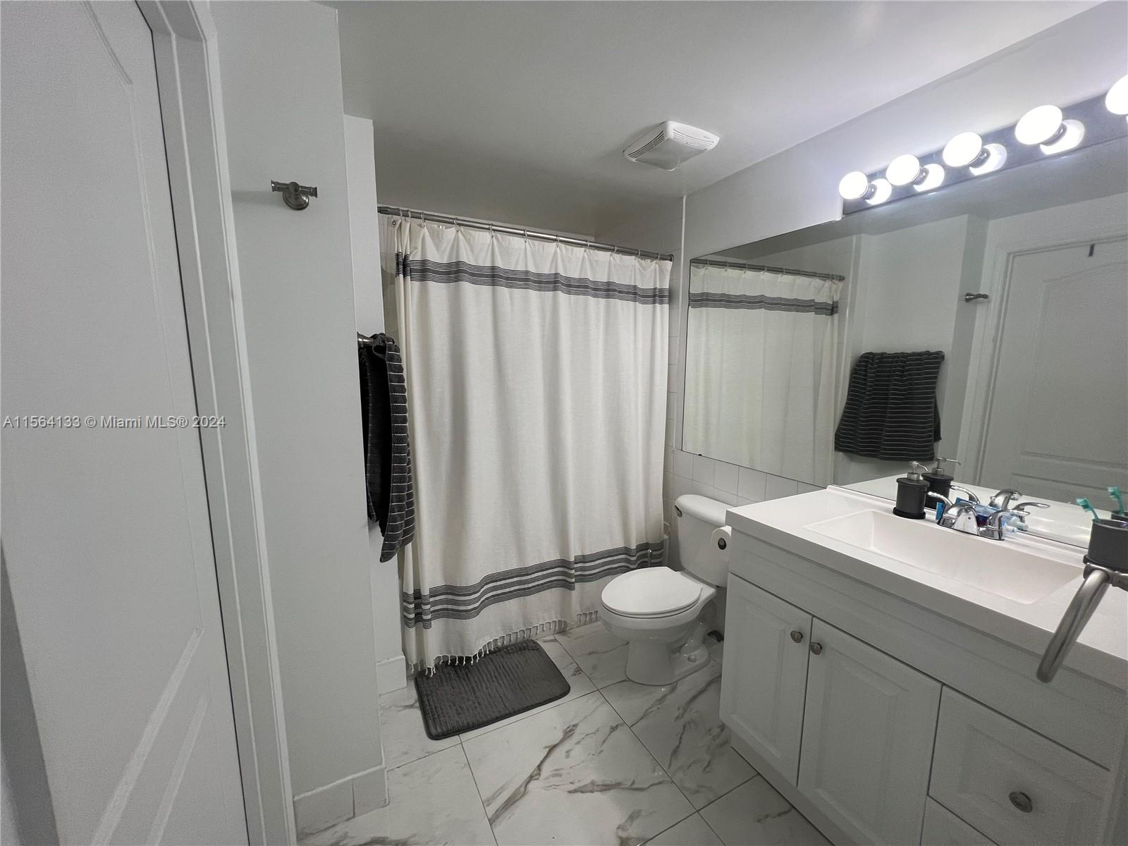 Flagami Miami, FL 33126 - Photo 2 of 16 a bathroom with a sink toilet and shower