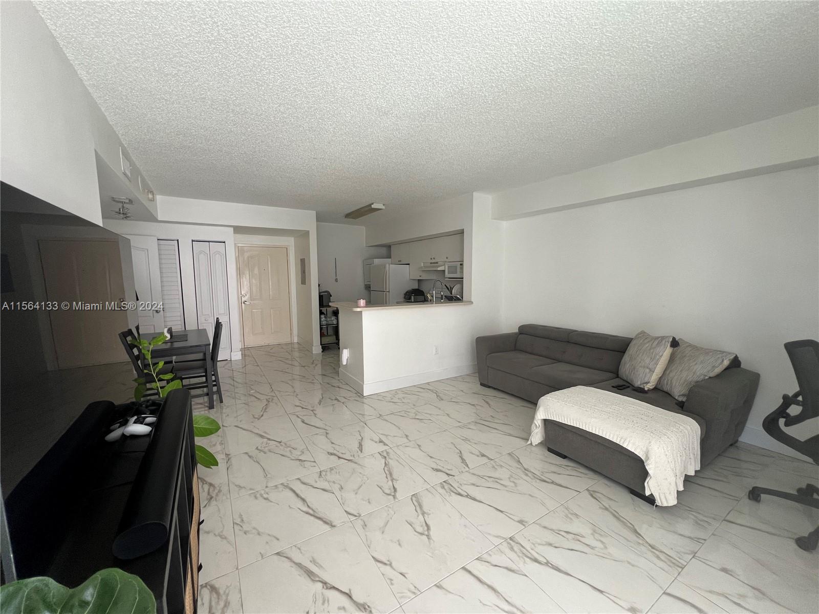 Flagami Miami, FL 33126 - Photo 4 of 16 a living room with furniture and a couch