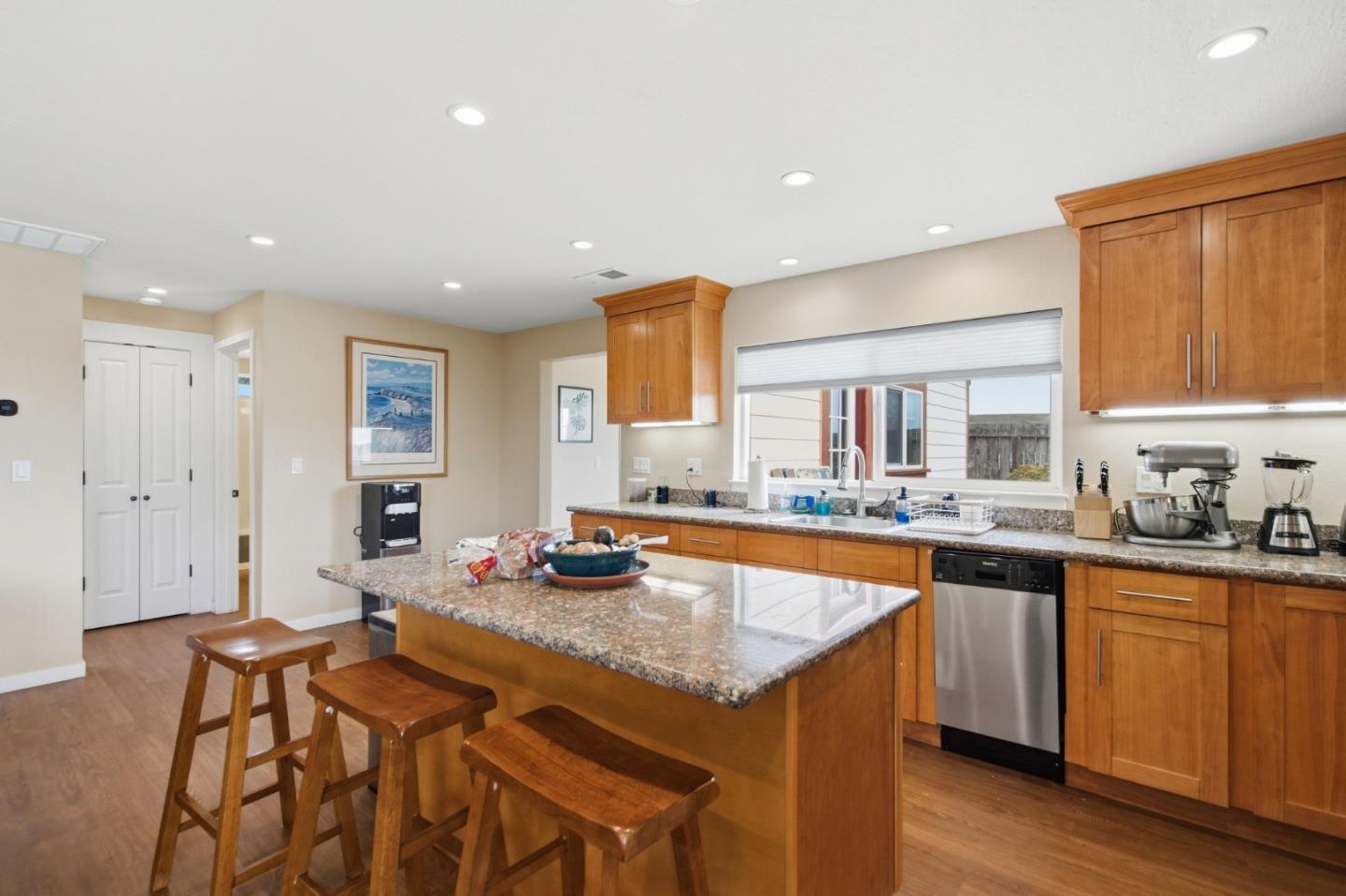1263 Reservoir Road Pescadero, CA 94060 - Photo 49 of 66 a kitchen with stainless steel appliances granite countertop a sink a stove a dining table and chairs