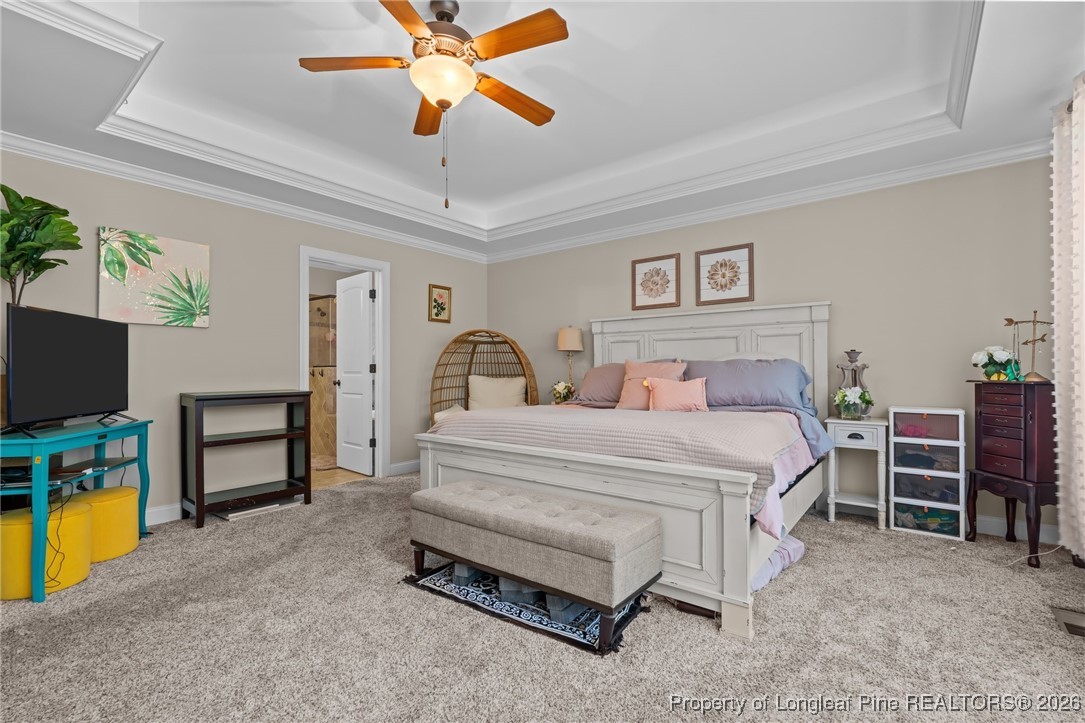 758 Micahs Way North Spring Lake, NC 28390 - Photo 31 of 36 a bedroom with furniture and a flat screen tv