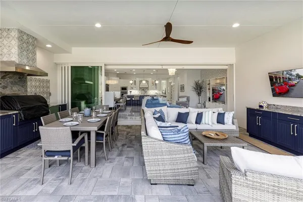 a large kitchen with a table and chairs