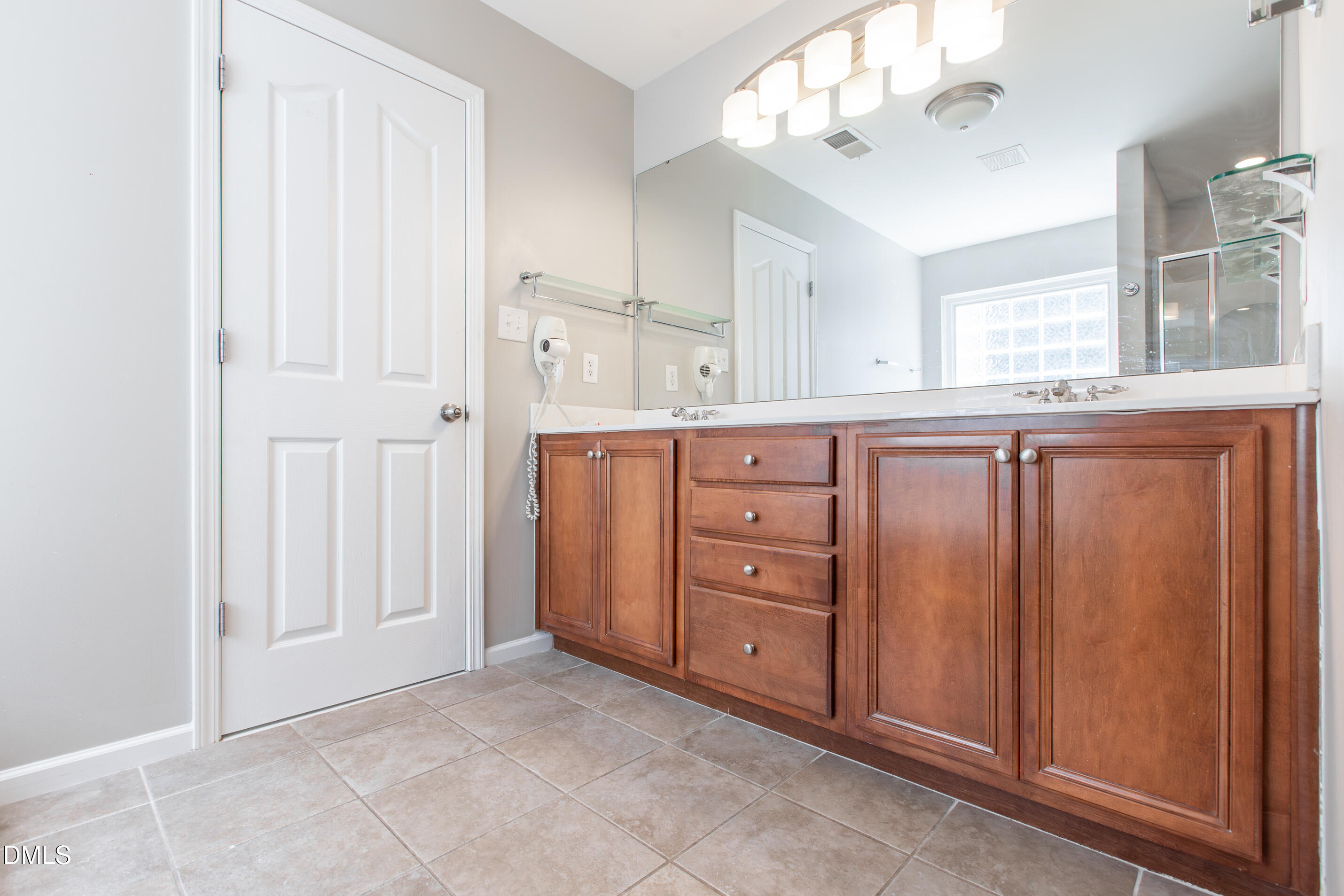 8006 Morrell Lane Durham, NC 27713 - Photo 25 of 38 a room with a dresser and mirror
