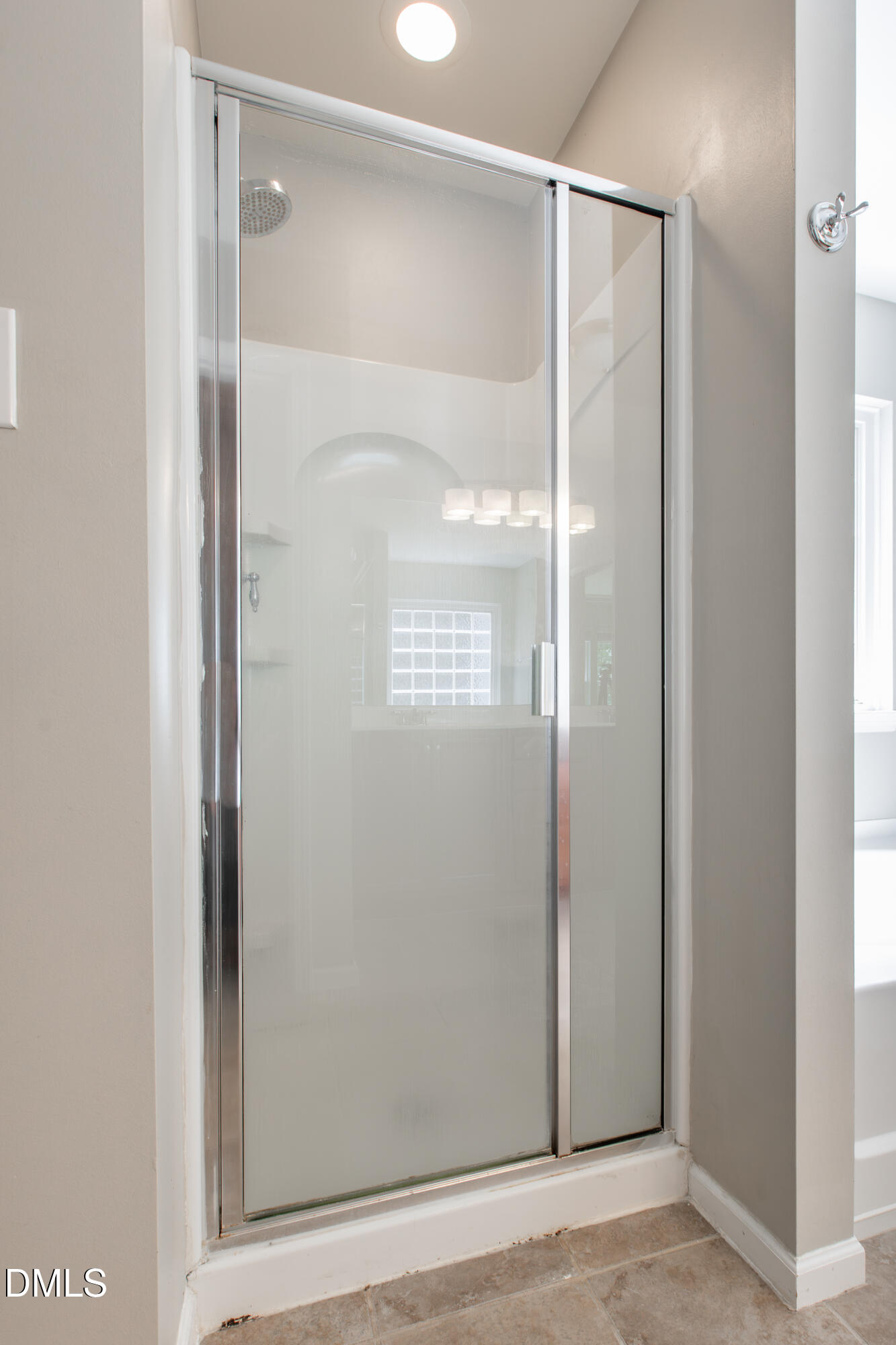 8006 Morrell Lane Durham, NC 27713 - Photo 28 of 38 a bathroom with a glass shower door