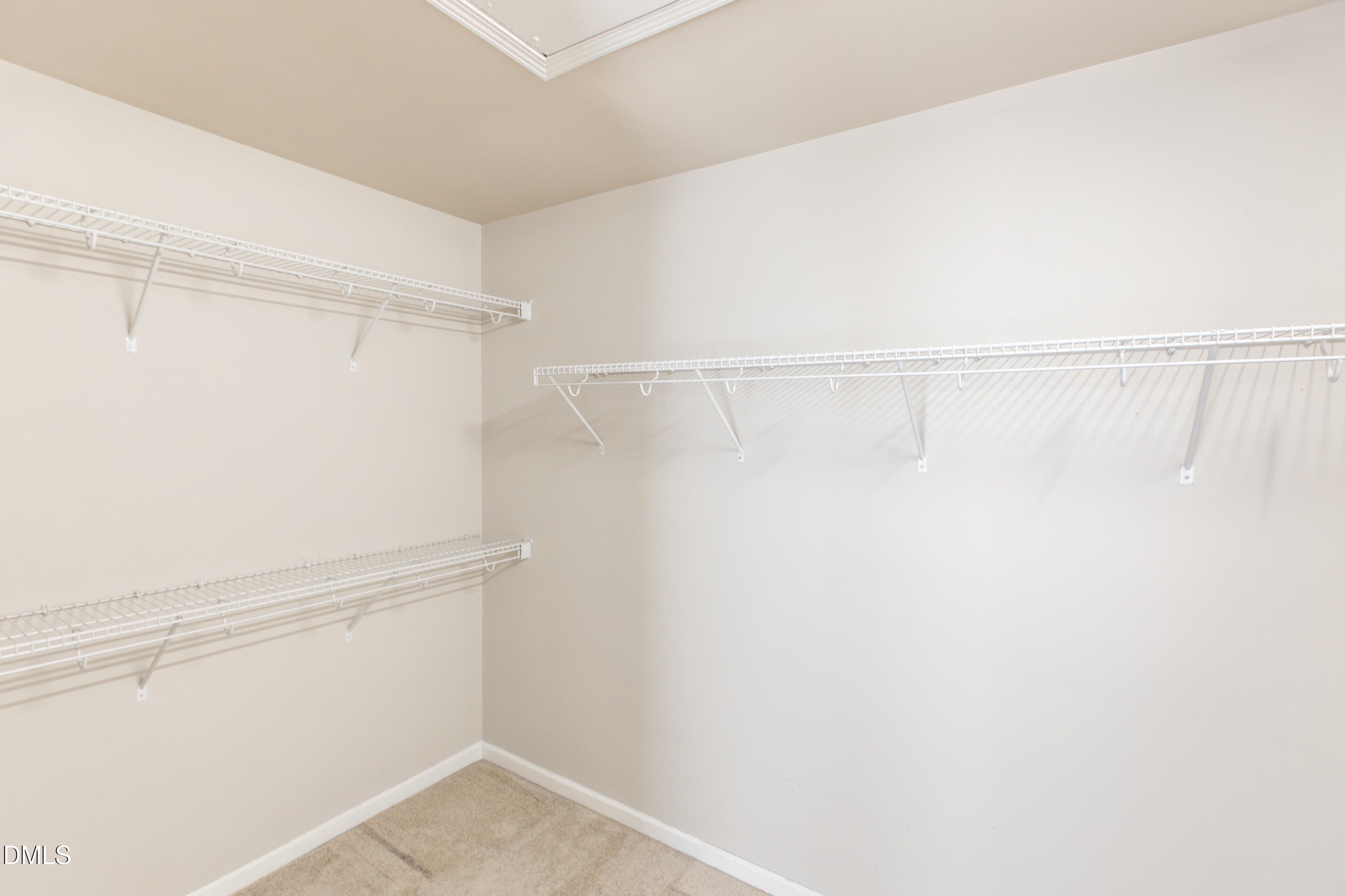 8006 Morrell Lane Durham, NC 27713 - Photo 29 of 38 a view of walk in closet with empty racks