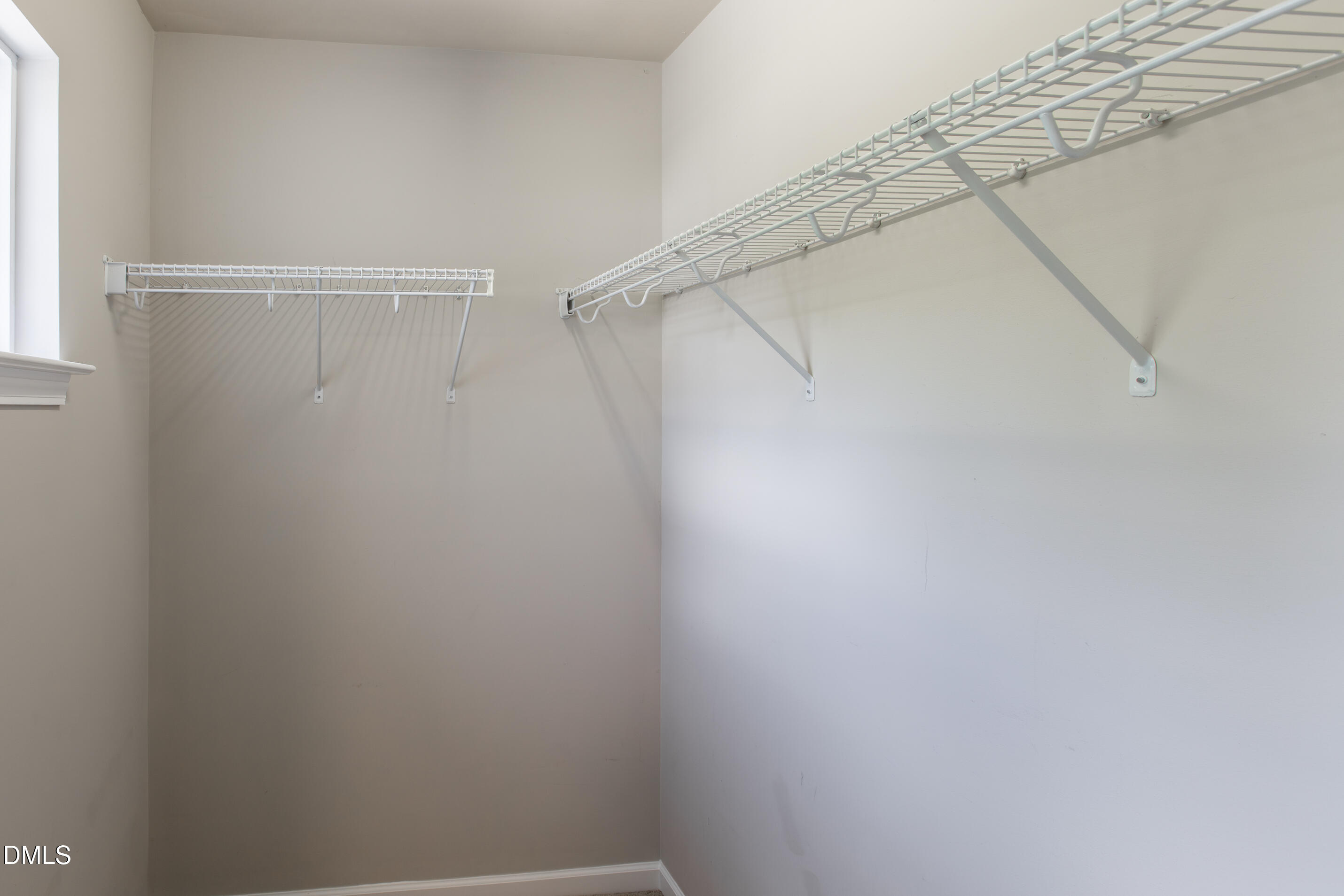 8006 Morrell Lane Durham, NC 27713 - Photo 33 of 38 a view of a room with racks on the wall