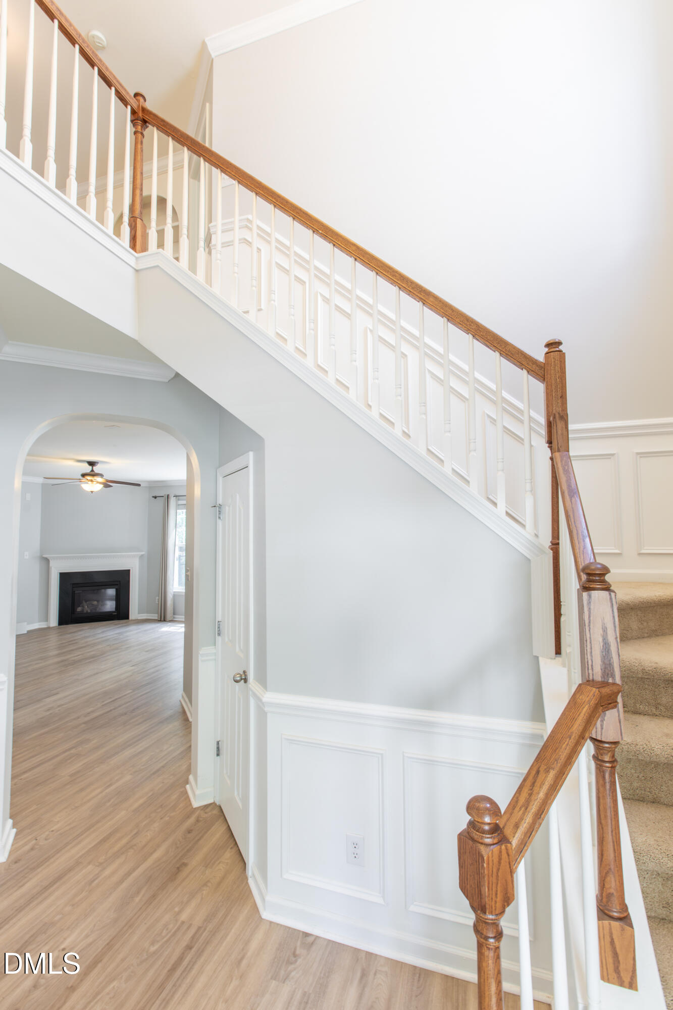 8006 Morrell Lane Durham, NC 27713 - Photo 8 of 38 a view of a hallway with wooden floor and staircase