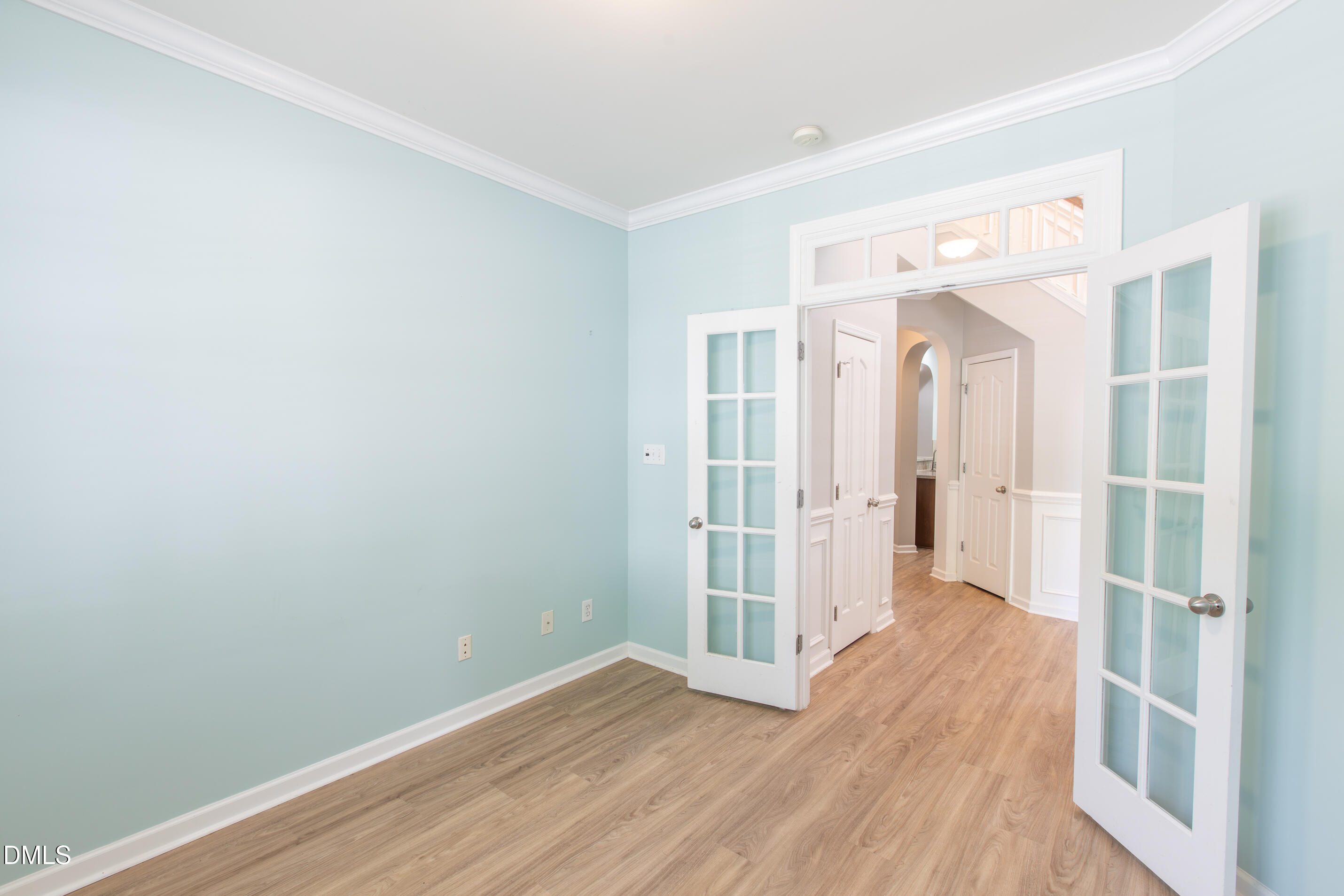 8006 Morrell Lane Durham, NC 27713 - Photo 9 of 38 a view of a hallway with wooden floor