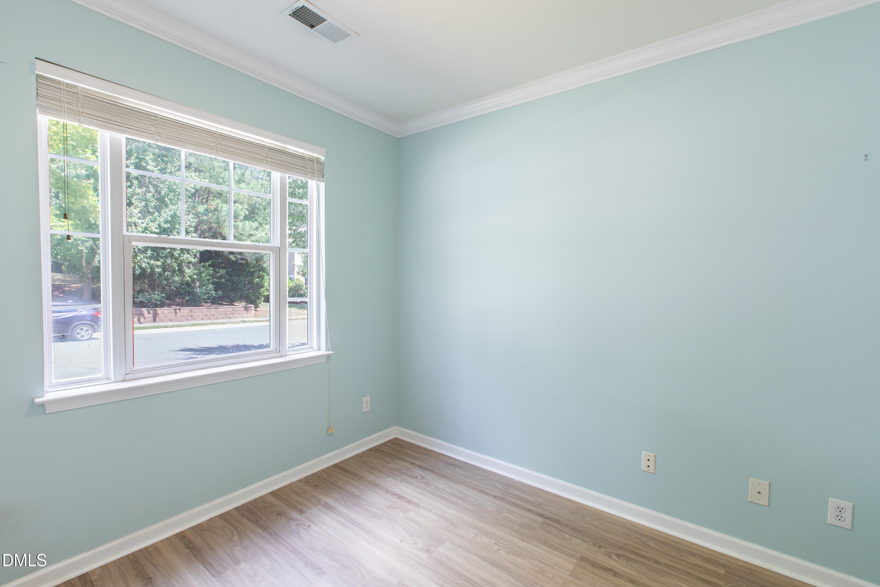 8006 Morrell Lane Durham, NC 27713 - Photo 10 of 38 a view of a room with wooden floor and a window