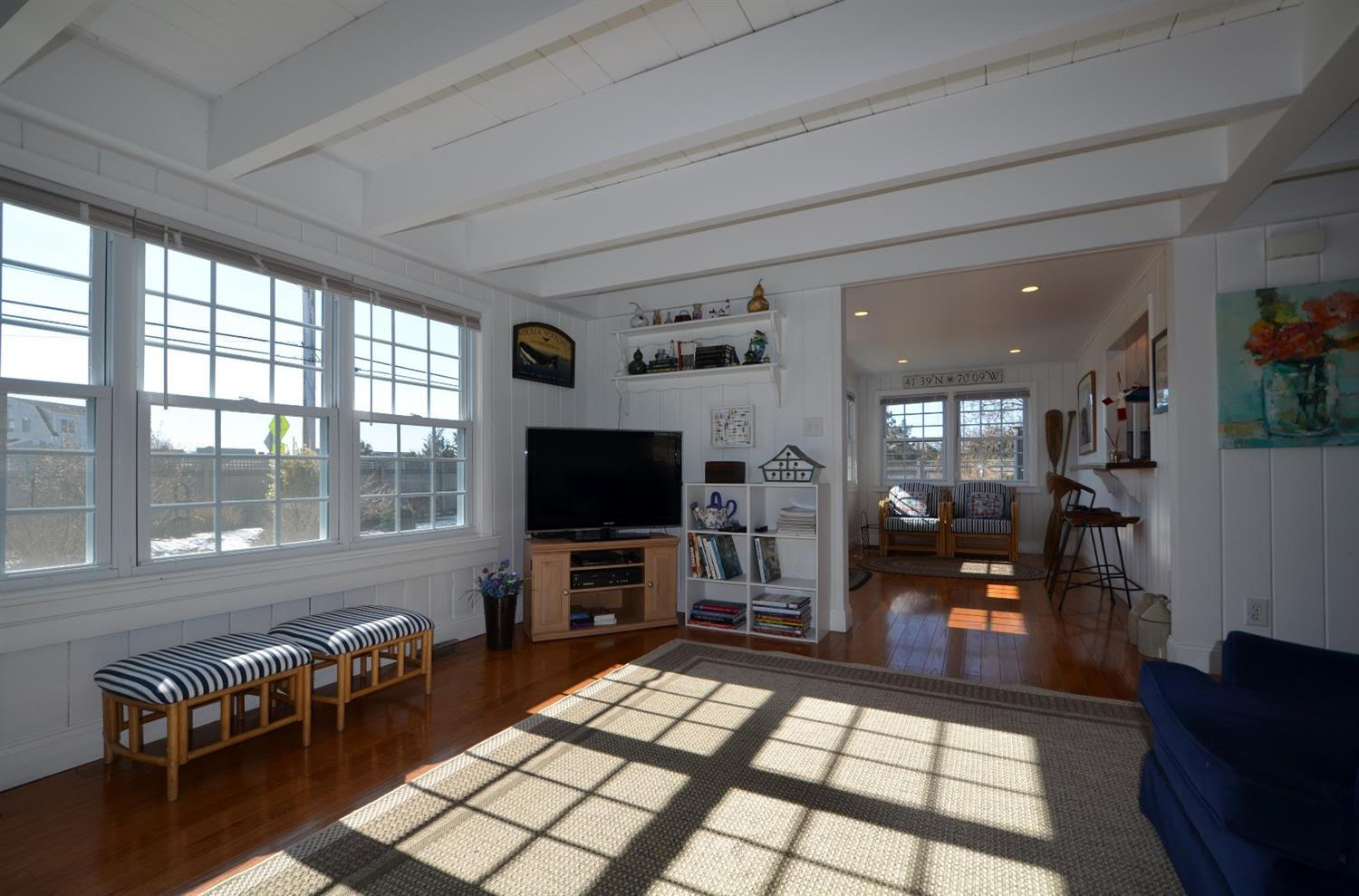 162 Lower County Road West Dennis, MA 02670 - Photo 6 of 27 a living room with furniture and a flat screen tv