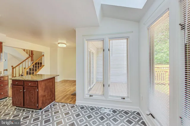 a view of a hallway with entryway door