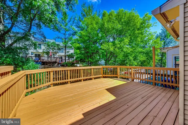 a view of balcony with deck and wooden floor