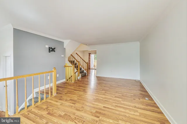 a view of an entryway with wooden floor