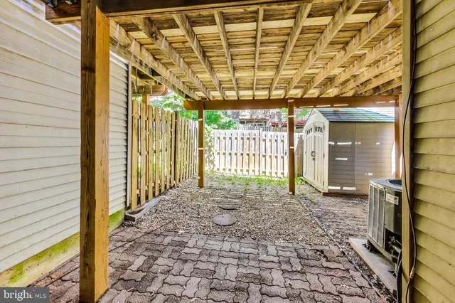 a view of a porch with a door and chair