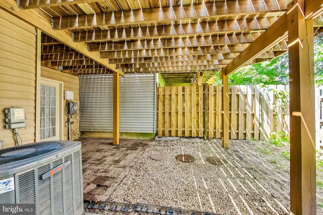 a view of a pathway of a house with wooden floor