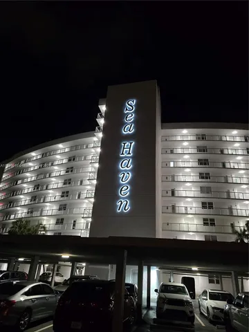a view of a balcony with chair and wooden floor
