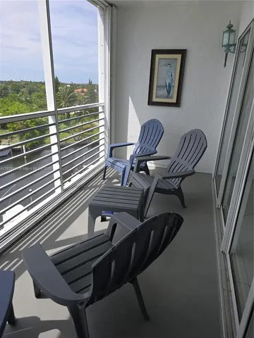 a view of a dining room with furniture and window
