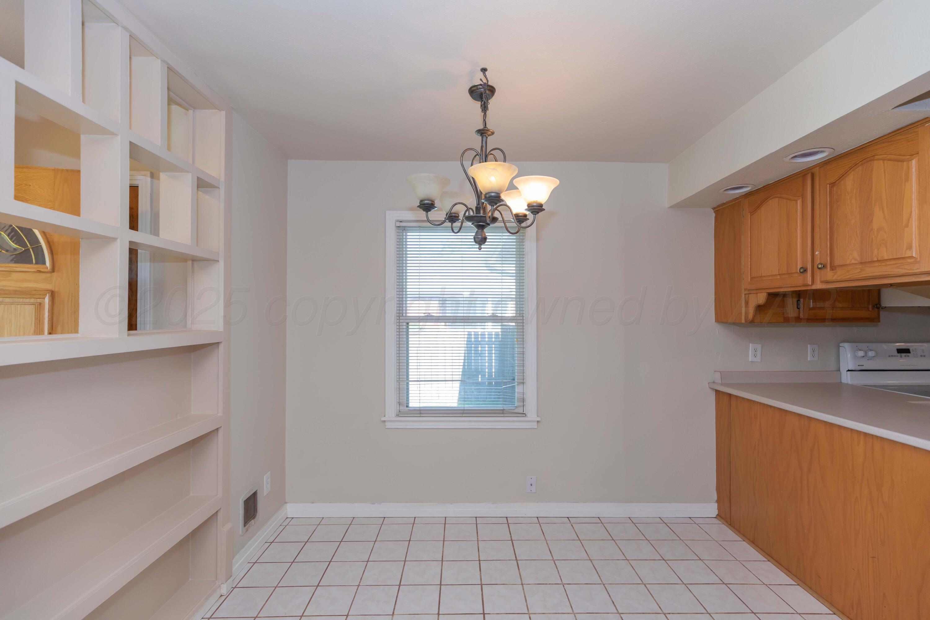 3513 Concord Road Amarillo, TX 79109 - Photo 14 of 45 a view of a kitchen with a sink cabinets and a window