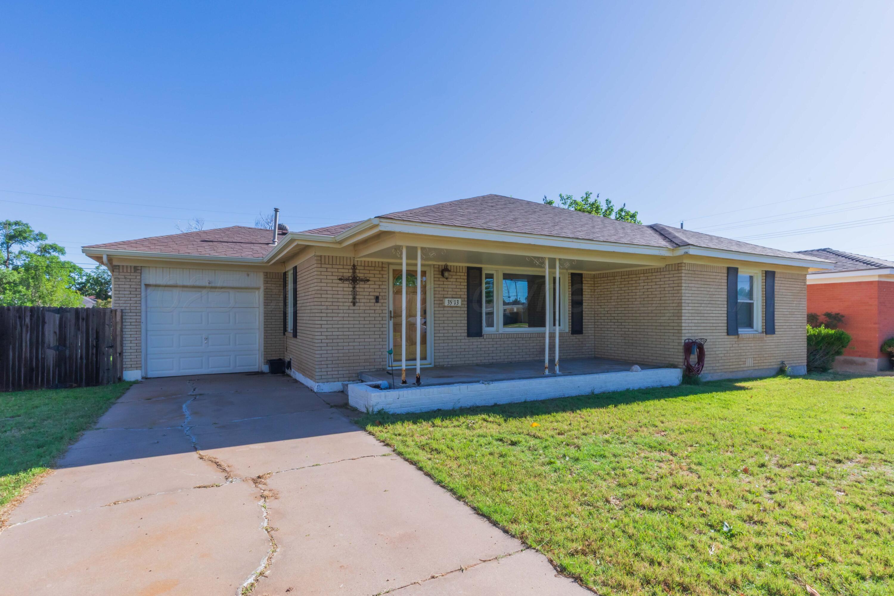 3513 Concord Road Amarillo, TX 79109 - Photo 2 of 45 a front view of a house with a yard and porch