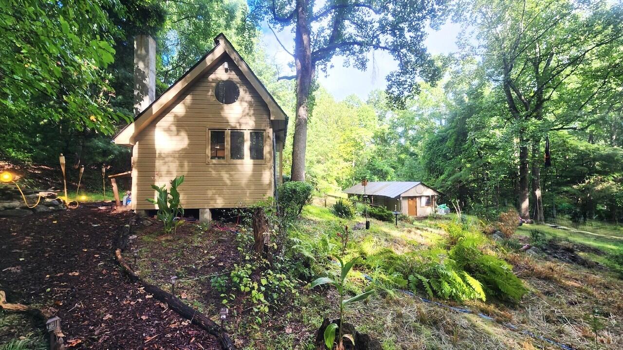 9737 Pine Forest Road Northeast Copper Hill, VA 24079 - Photo 1 of 41 a backyard of a house with lots of green space