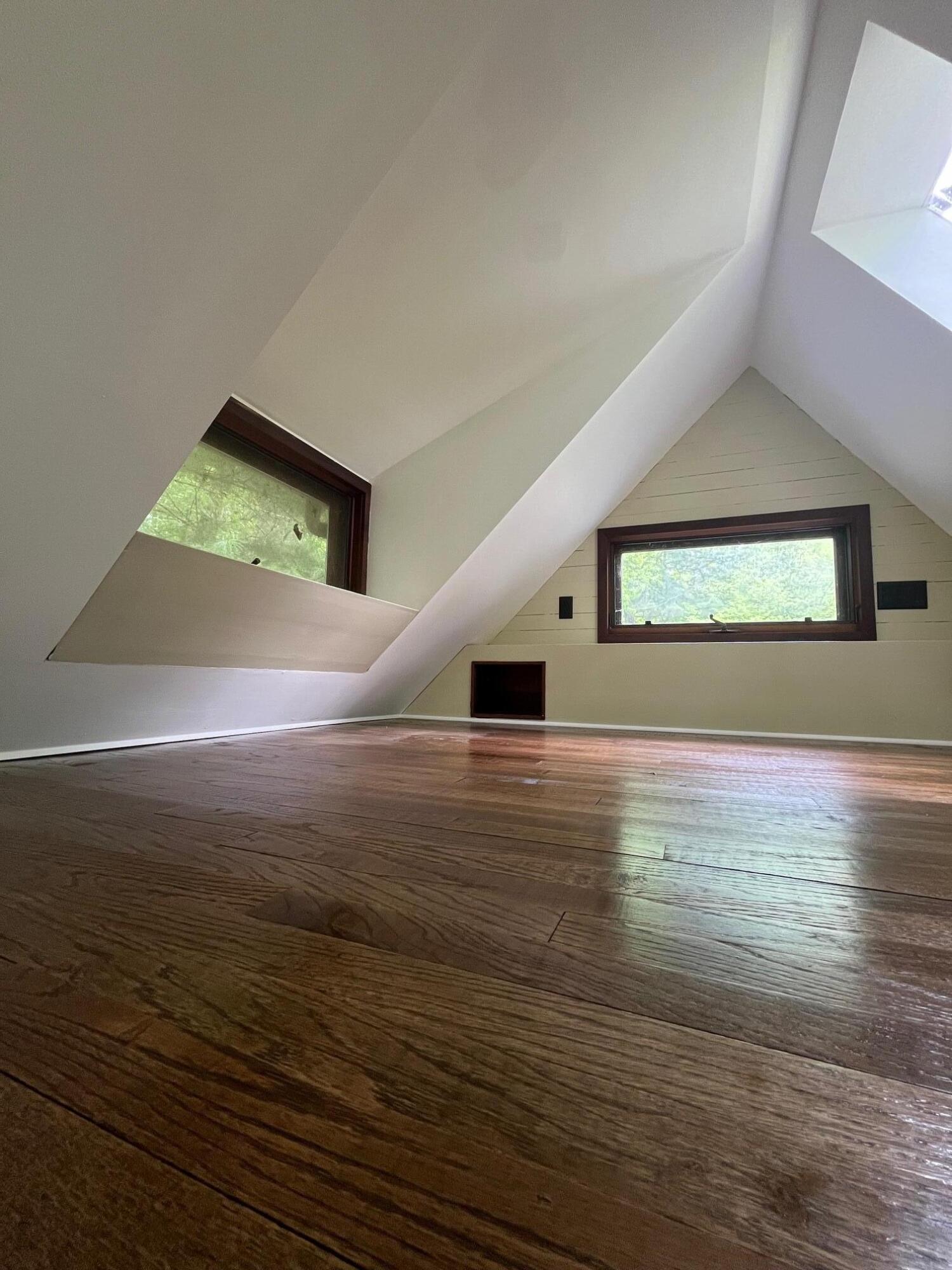 9737 Pine Forest Road Northeast Copper Hill, VA 24079 - Photo 17 of 41 an empty room with wooden floor and windows