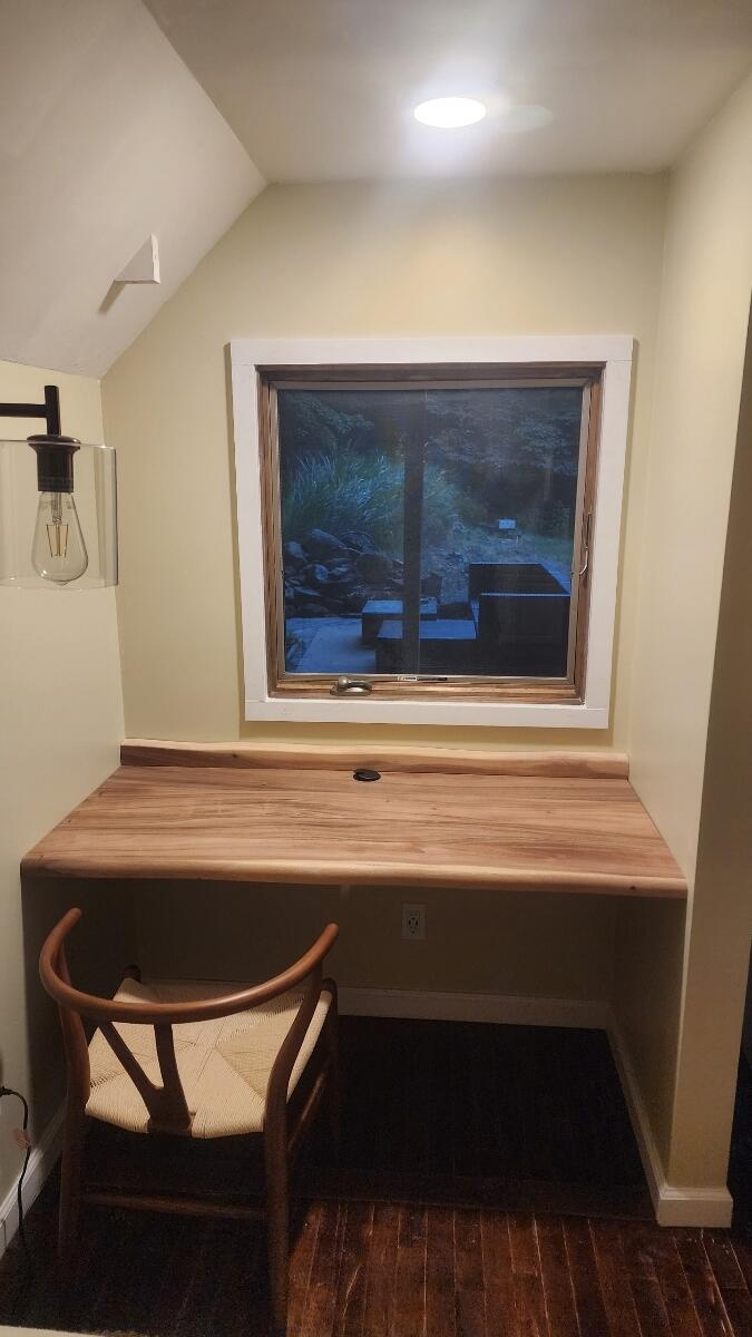 9737 Pine Forest Road Northeast Copper Hill, VA 24079 - Photo 20 of 41 a room with a table and a fireplace