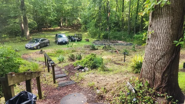 a backyard of a house with lots of green space