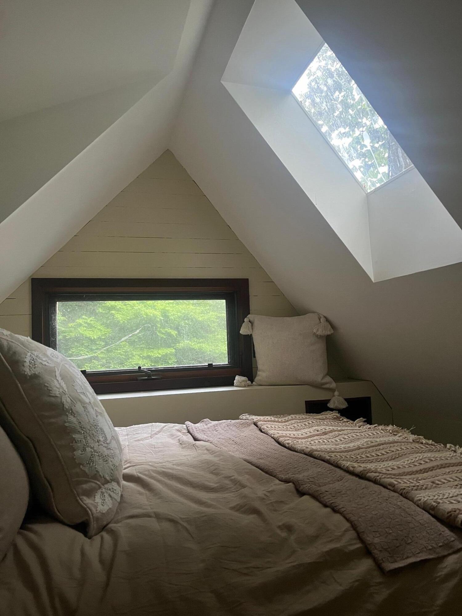 9737 Pine Forest Road Northeast Copper Hill, VA 24079 - Photo 39 of 41 a bed sitting in a bedroom next to a window