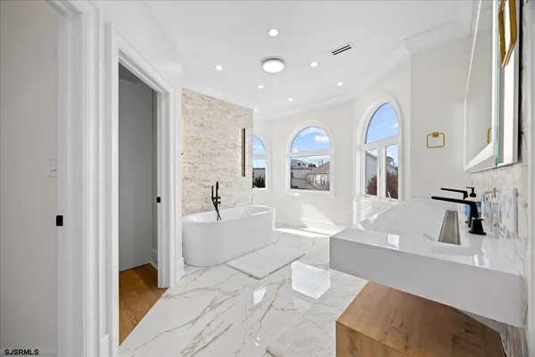 a bathroom with a bathtub and a sink