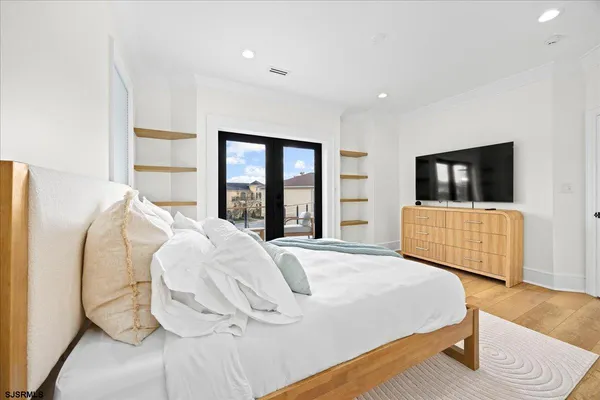 a view of a room with lots of wooden furniture