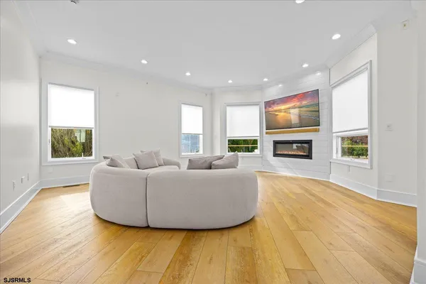 a spacious bedroom with a large bed and a fireplace