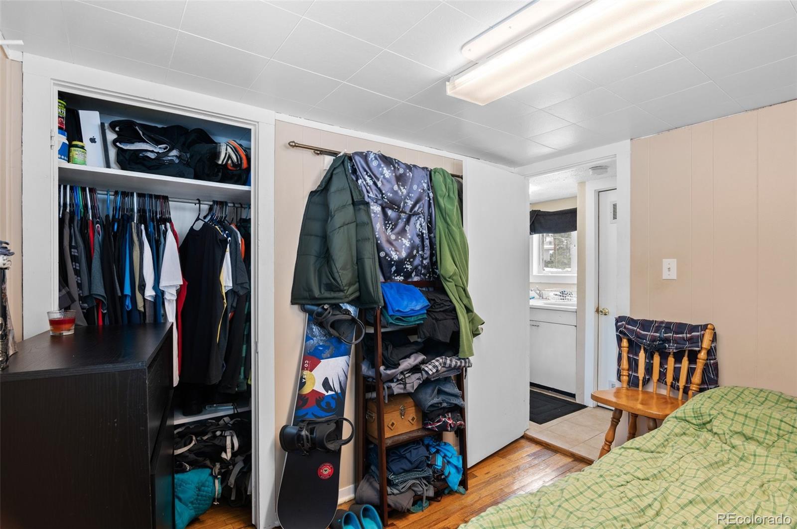 4997 Camel Heights Road Evergreen, CO 80439 - Photo 13 of 24 a view of a living room with clothes and shoes