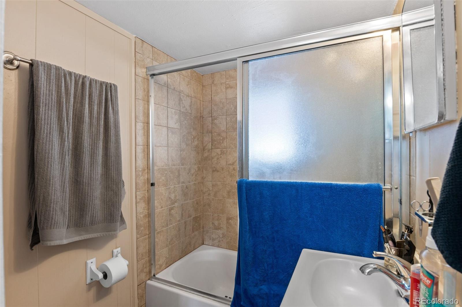 4997 Camel Heights Road Evergreen, CO 80439 - Photo 14 of 24 a bathroom with a shower and a sink