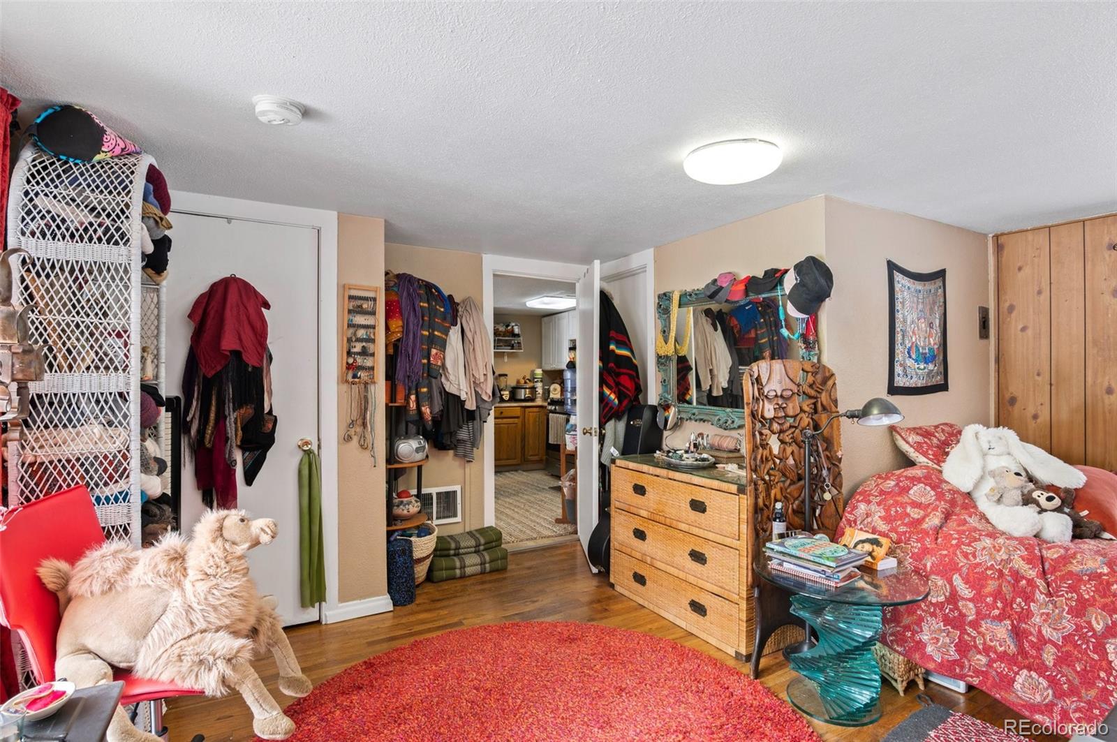 4997 Camel Heights Road Evergreen, CO 80439 - Photo 22 of 24 a view of a bedroom with workspace and toys