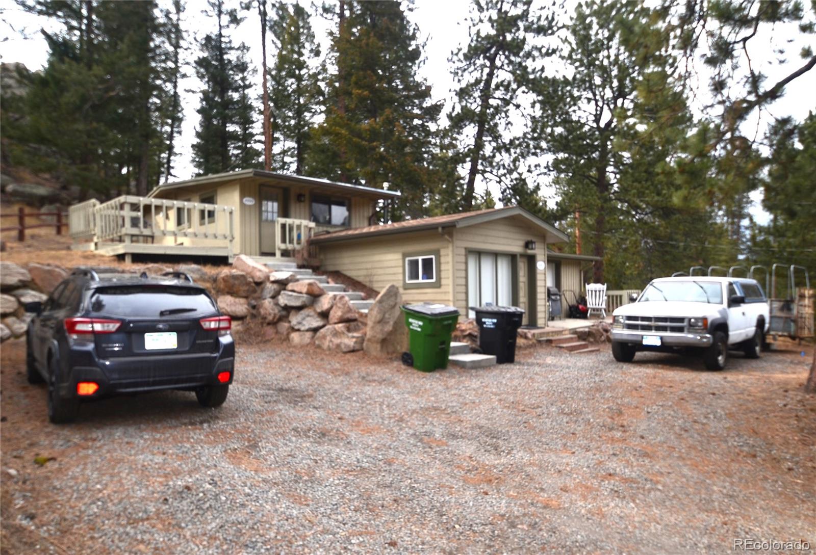 4997 Camel Heights Road Evergreen, CO 80439 - Photo 24 of 24 a view of a cars park in front of house