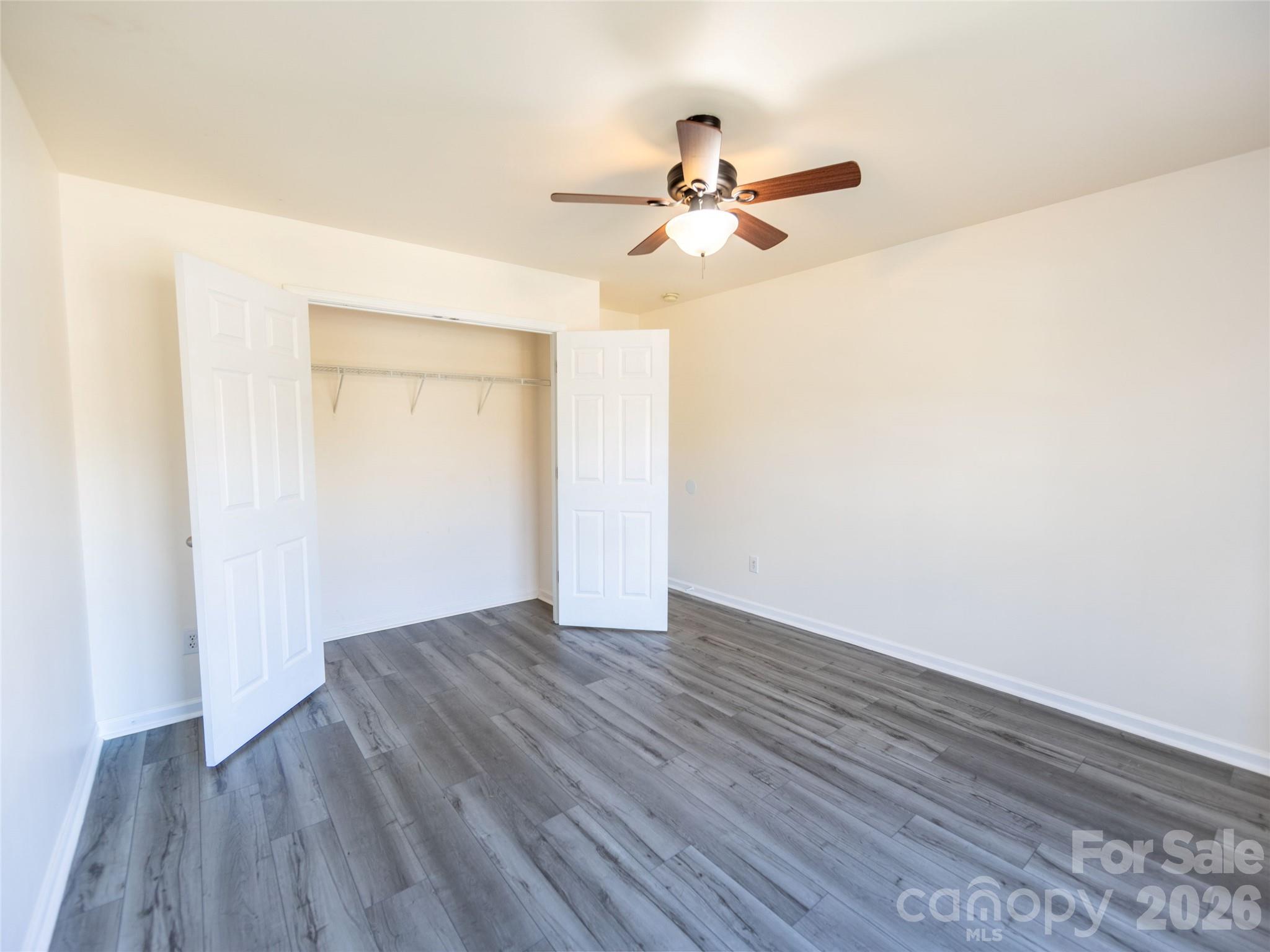 6002 Brook Valley Run Monroe, NC 28110 - Photo 25 of 32 a view of empty room with wooden floor