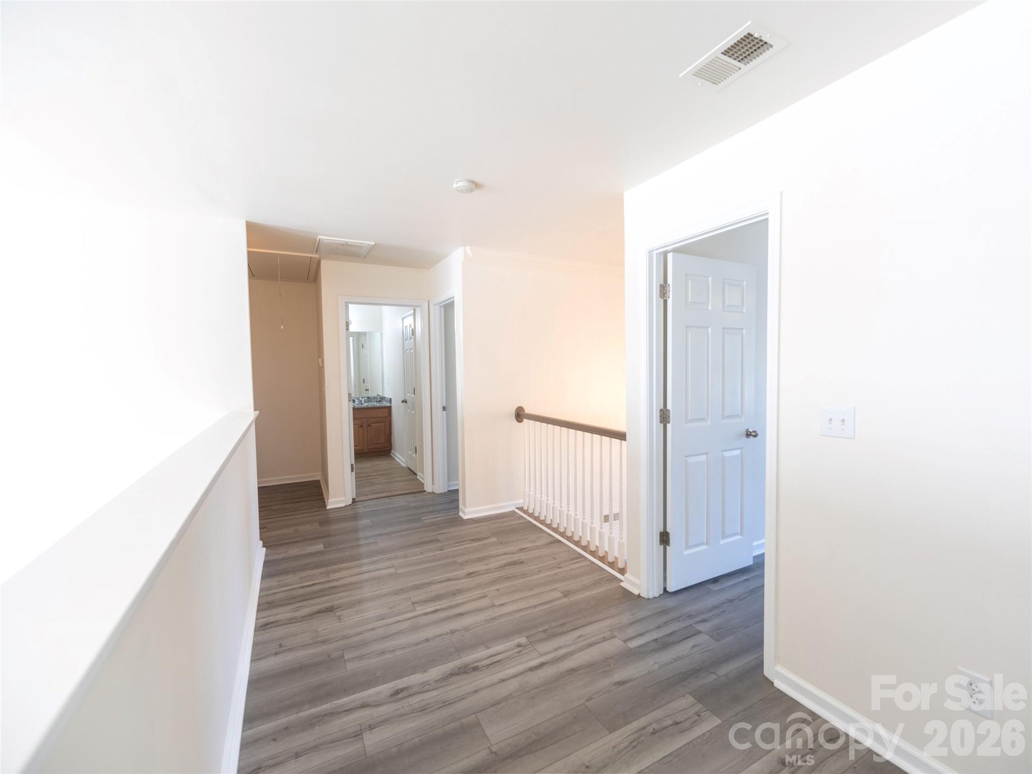 6002 Brook Valley Run Monroe, NC 28110 - Photo 28 of 32 a view of a hallway with wooden floor