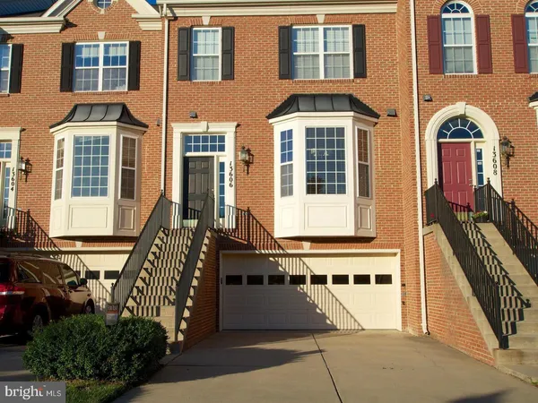 a front view of a building with many windows
