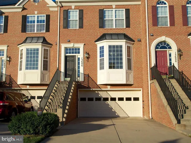 a front view of a building with many windows