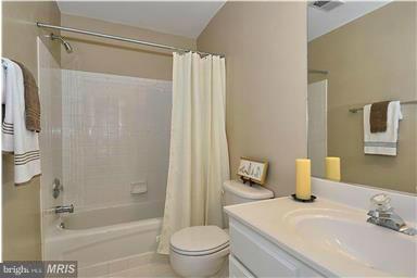 13606 Mills Farm Road Rockville, MD 20850 - Photo 13 of 18 a bathroom with a sink toilet and shower