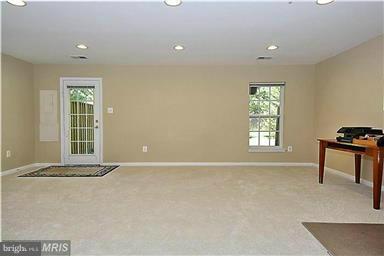 13606 Mills Farm Road Rockville, MD 20850 - Photo 14 of 18 a view of an empty room with a window