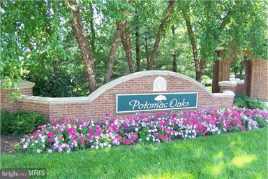 13606 Mills Farm Road Rockville, MD 20850 - Photo 18 of 18 a sign that is in front of flowers