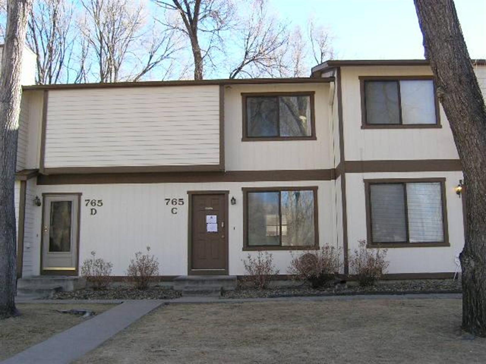 765 Alexander Road, Unit C Colorado Springs, CO 80909 - Photo 1 of 1 a front view of a house