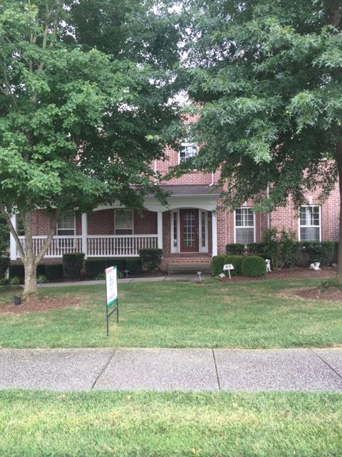 1615 Fair House Road Spring Hill, TN 37174 - Photo 1 of 19 a front view of a house with a yard
