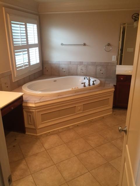 1615 Fair House Road Spring Hill, TN 37174 - Photo 14 of 19 a bathroom with a bathtub and a window