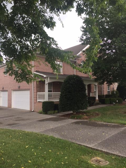 1615 Fair House Road Spring Hill, TN 37174 - Photo 2 of 19 a front view of a house with a yard and garage