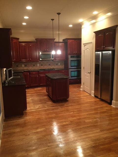 1615 Fair House Road Spring Hill, TN 37174 - Photo 10 of 19 a kitchen with stainless steel appliances granite countertop a refrigerator a sink and a stove