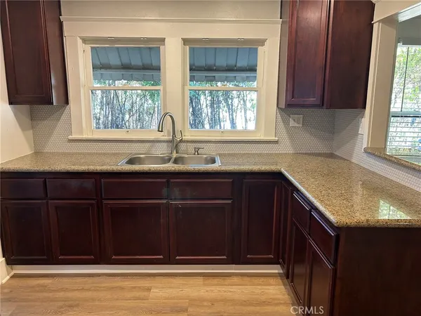 a kitchen with a sink and a window
