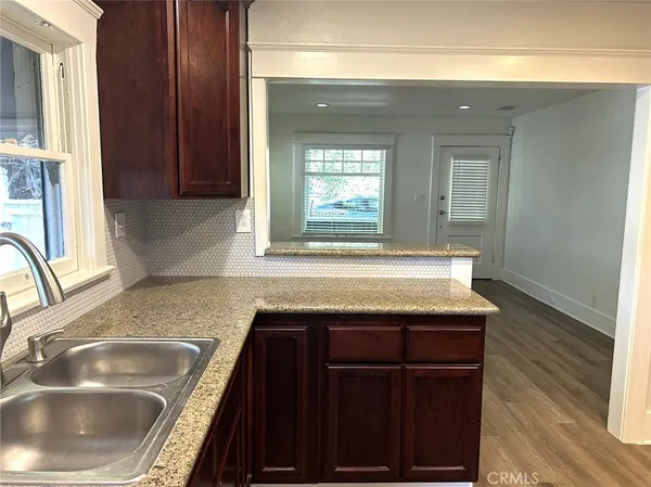 a kitchen with a sink and a window